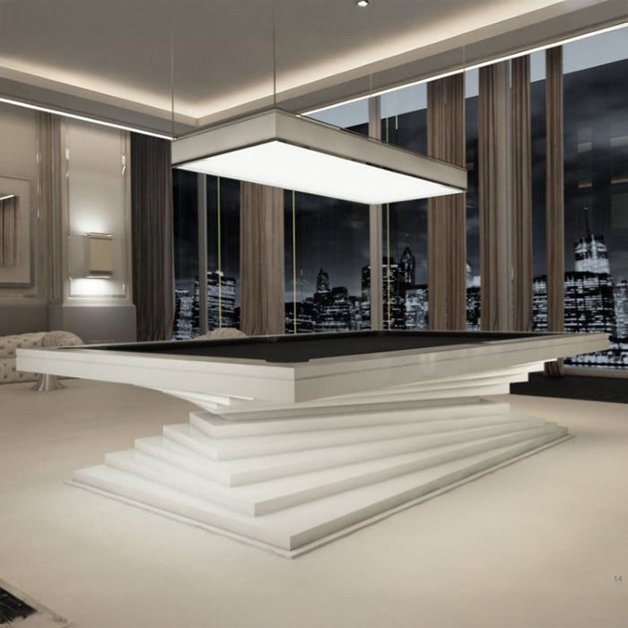 A sleek white and black MBM Biliardi Ziggurat pool table in a modern luxury apartment with breathtaking city views at night.