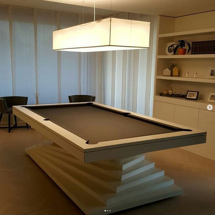 An MBM Biliardi Ziggurat pool table with a clean white finish, complementing a minimalist and modern home interior design.