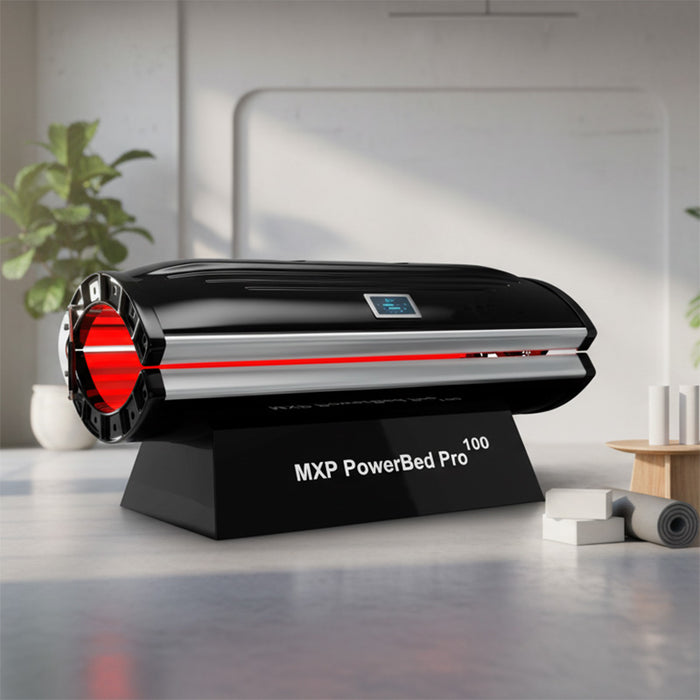 MXP PowerBed Pro 100 red light therapy machine in a contemporary yoga studio, paired with fitness props for integrative wellness and light treatment.