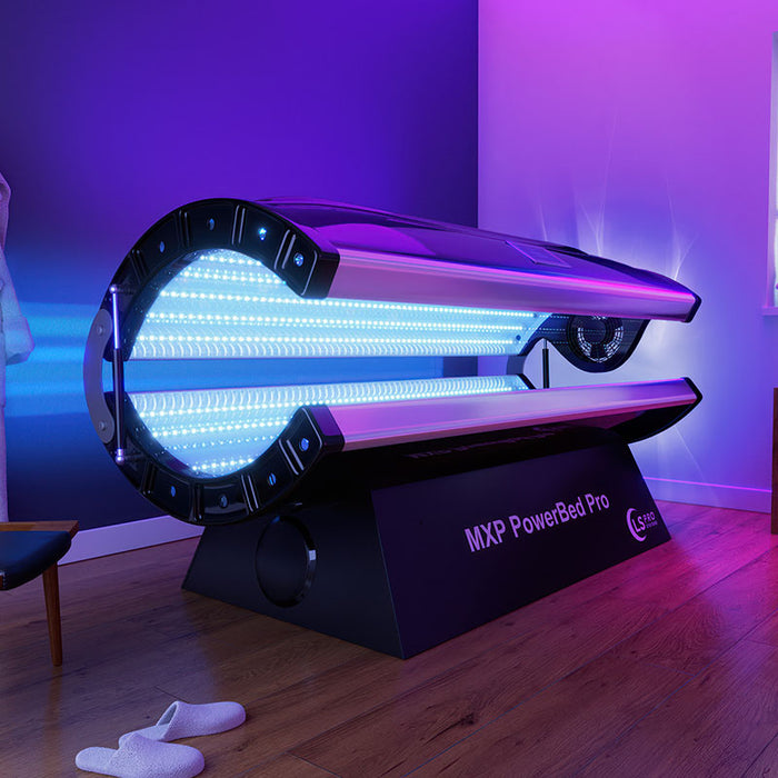 Modern MXP PowerBed Pro 100 red light therapy bed in a luxury spa setting, illuminated with blue and purple LED lights, promoting full-body light therapy and wellness recovery.