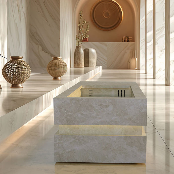 Nordic Vitality LOKI Ice Bath in a cream marble finish, beautifully integrated into a tranquil luxury spa interior for ultimate cold immersion therapy.