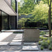Nordic Vitality THOR Ice Bath in Grigio Blend finish placed in a contemporary Japanese garden with stone path, foliage, and modern architecture.