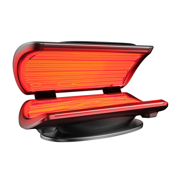 Open left-angle view of the Nuvibody CORE red light bed with visible internal infrared and LED therapy lights in use.
