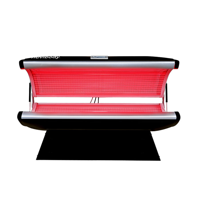Front view of the Nuvibody LITE red light therapy bed glowing with LED panels, designed for full-body photobiomodulation and rejuvenation treatments.