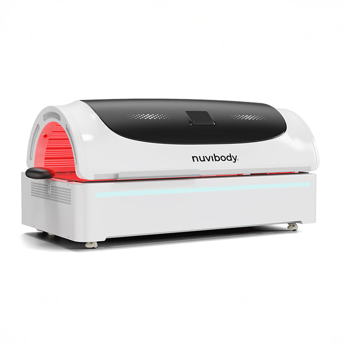 Closed rear side view of the Nuvibody PRO white red light therapy bed with curved dome and ergonomic structure.
