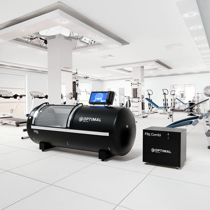 The F85 Steel Hyperbaric Chamber positioned in a state-of-the-art gym, supporting faster muscle recovery, improved endurance, and athletic performance enhancement.