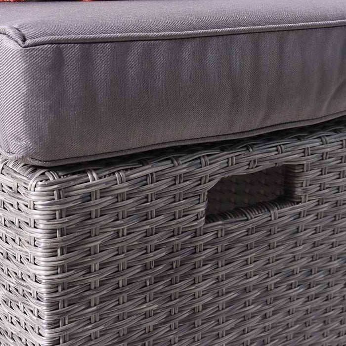 A close-up of the Paris 10 Seater Cube Set stool, featuring a thick grey cushion on top of the durable rattan structure.