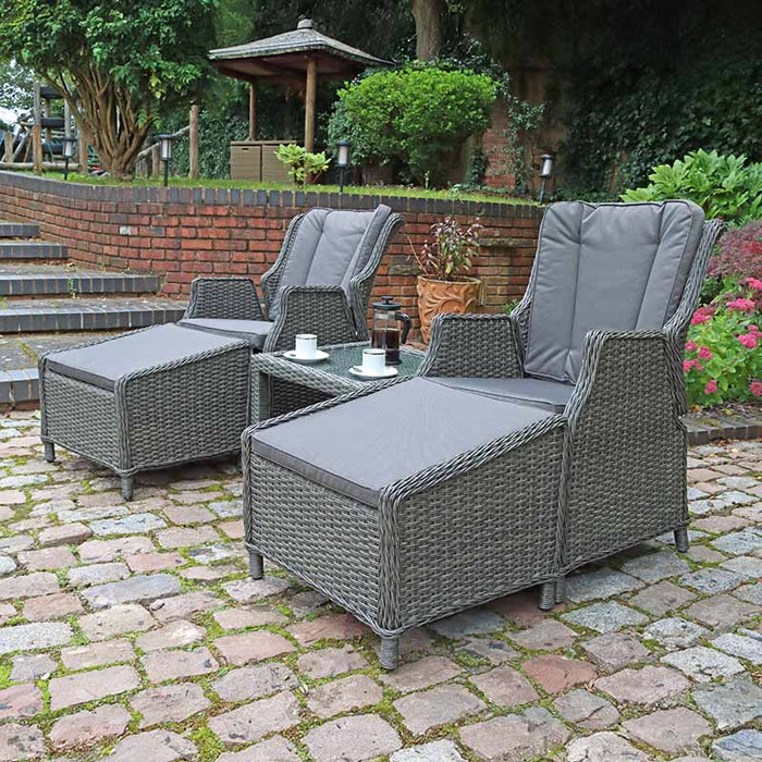 This image displays the Paris 2 Seater High Back Recliner Comfort Set, complete with footstools, ideal for outdoor relaxation.