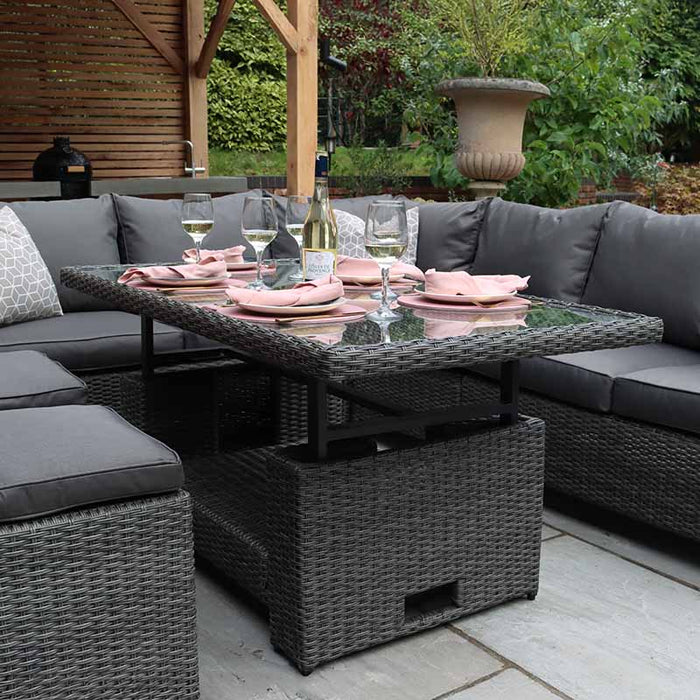 Close-up of the Paris Deluxe Corner Dining Set, highlighting the rattan weave and glass table.