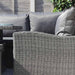 A detailed close-up of the Paris Deluxe Modular Corner Dining Set highlighting the high-quality rattan weave and plush grey cushions, perfect for outdoor lounging.