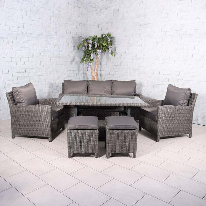 Complete view of the Paris 7 Seater Deluxe Sofa Dining Set arranged indoors, highlighting the grey wicker design, comfortable seating, and versatile glass-top table, ideal for indoor dining and relaxation.