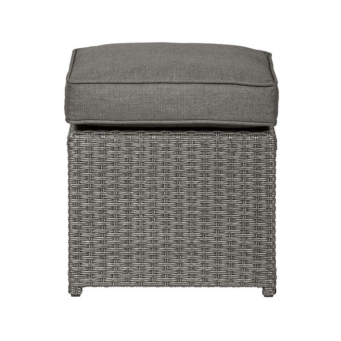 Front view of the cushioned stool from the Paris 7 Seater Deluxe Sofa Dining Set, showcasing the grey wicker weave and thick, comfortable cushion, perfect for additional seating or as a footrest.