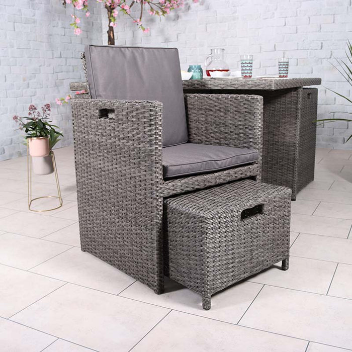 Paris 8 Seater Cube Set chair with footstool neatly stored underneath, highlighting the space-saving design in an indoor environment.