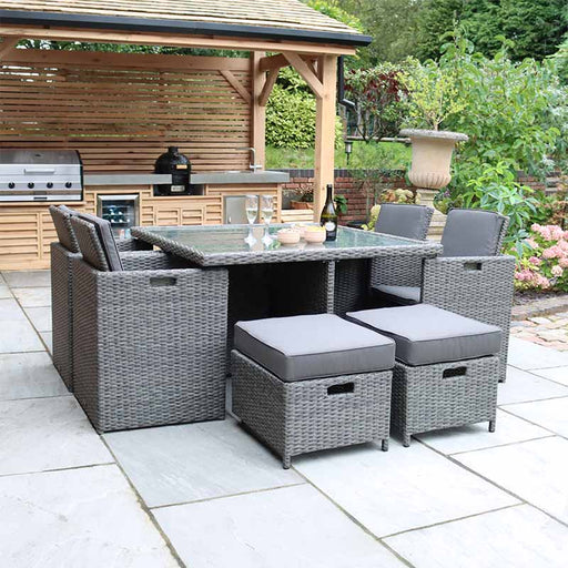 Paris 8 Seater Cube Set shown in a contemporary garden setting with the seats arranged for comfortable outdoor dining.