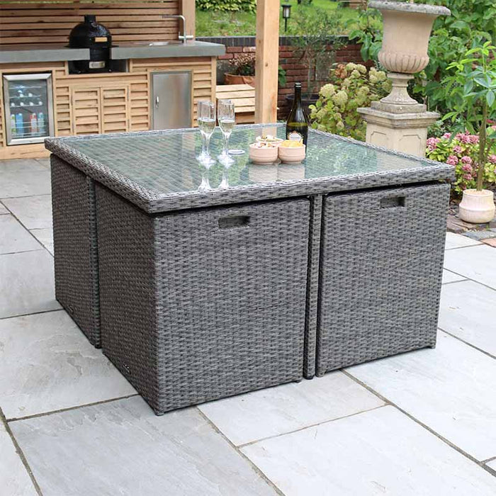 Paris 8 Seater Cube Set compactly stored under the table, highlighting the practical design for small garden spaces.