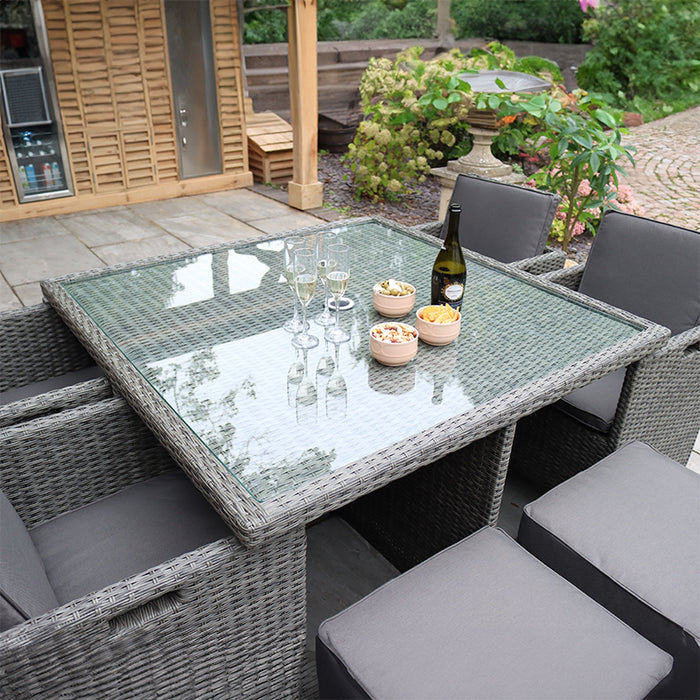 Top view of the Paris 8 Seater Cube Set arranged for outdoor dining, featuring a glass table with drinks and snacks.