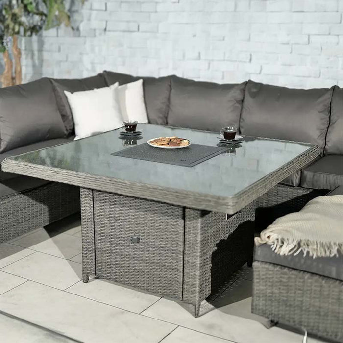 Square fire pit table with tempered glass top in the Paris Fire Pit Corner Dining Set, ideal for outdoor lounging.