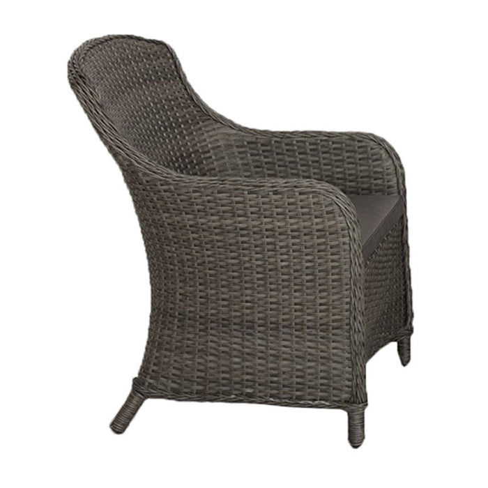 Side view of a rattan chair from the Paris Imperial Round Dining Set, highlighting the ergonomic design and textured finish.