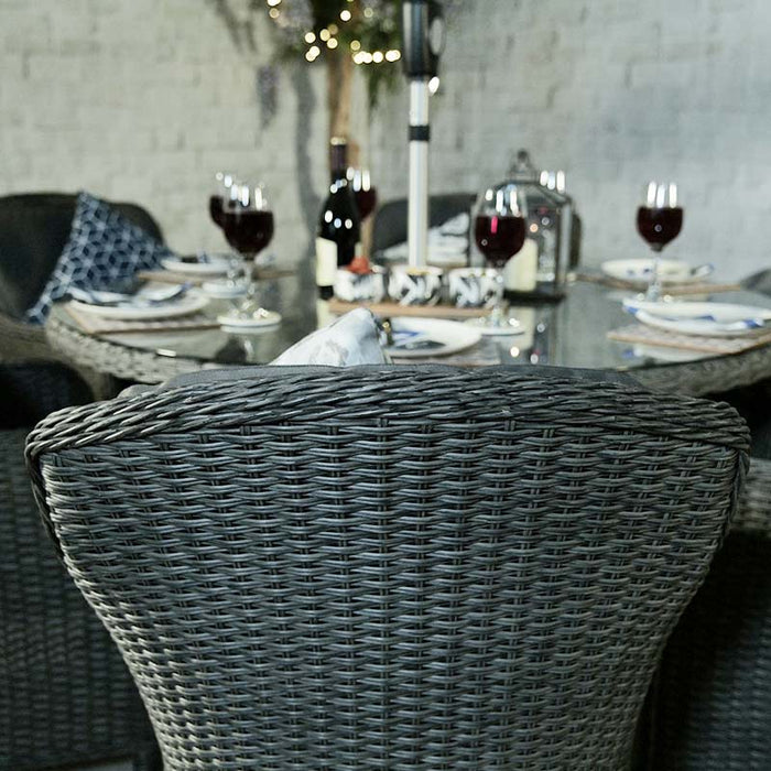 A back view of the Paris Imperial Round Dining Set chair, highlighting the ergonomic design and premium rattan weaving.