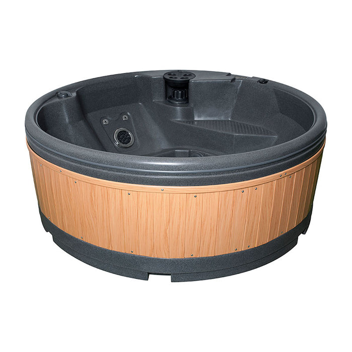  A circular hot tub with teak wood panels and grey interior, featuring multiple jets.