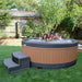  Family enjoying time together in an outdoor hot tub with teak panels.