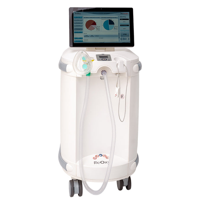 ReOxy Hypoxic Therapy Device in white cylindrical casing, front-facing view on wheels, touchscreen displaying session analytics pie charts, breathing mask and tubing at front.