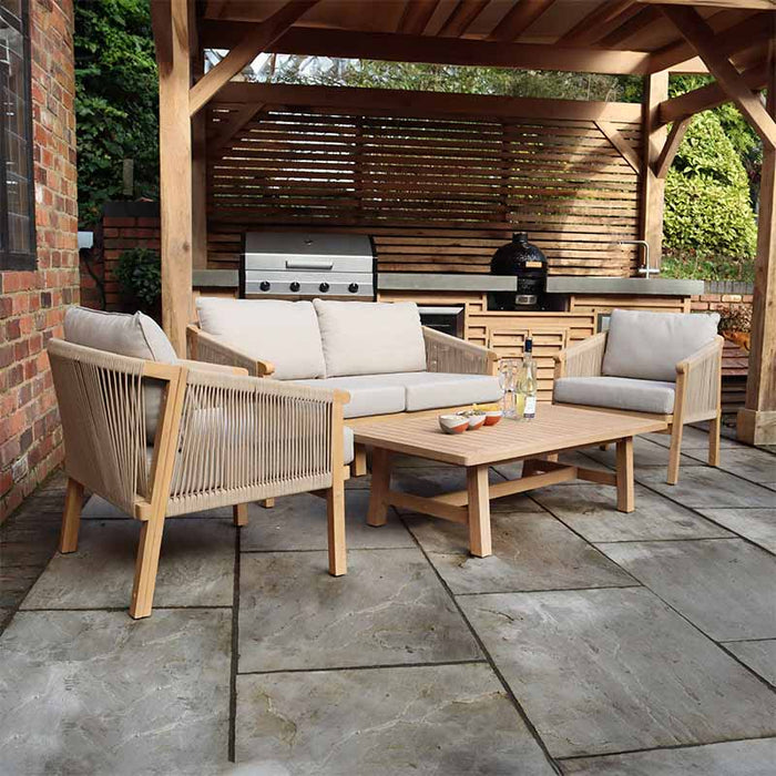 Angled view of the Roma 4 Seater Double Lounge Set, highlighting the elegant acacia wood structure and plush beige cushions, perfect for outdoor lounging.