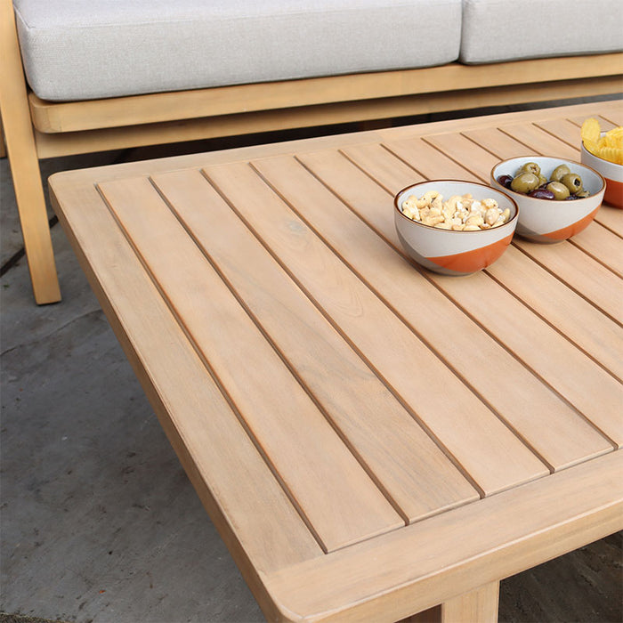 A close-up shot of the coffee table in the Roma 4 Seater Double Lounge Set, featuring a natural acacia wood finish with slatted design, perfectly complementing the set’s outdoor elegance.