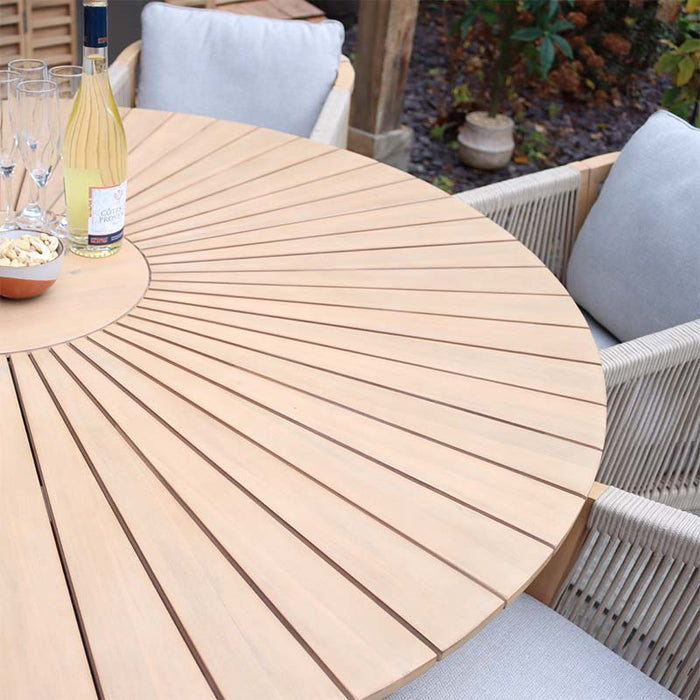 Close-up of the round wooden table from the Roma 6 Seater Dining Set, highlighting the sleek tabletop design and detailed wood grain.