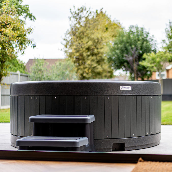 Stylish backyard installation featuring Rotospa Orbis Hot Tub in a landscaped garden.