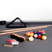 RS Barcelona Diagonal outdoor pool table accessories including cues, balls, triangle rack and brush on table surface, billiard setup detail.