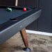 Close-up of RS Barcelona Diagonal outdoor pool table corner in black finish, detailed billiard table edge with wooden leg and balls on felt surface