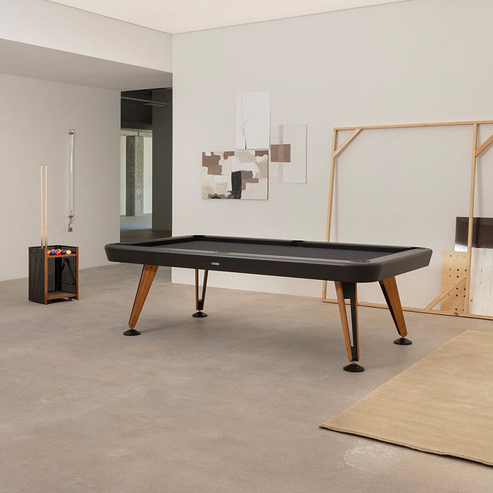 RS Barcelona Diagonal outdoor pool table in black with wooden legs in minimalist interior, modern billiard table in contemporary living space.