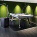 RS Barcelona Diagonal outdoor pool table in contemporary indoor sports room with green wall, stylish billiards table with modern lighting.