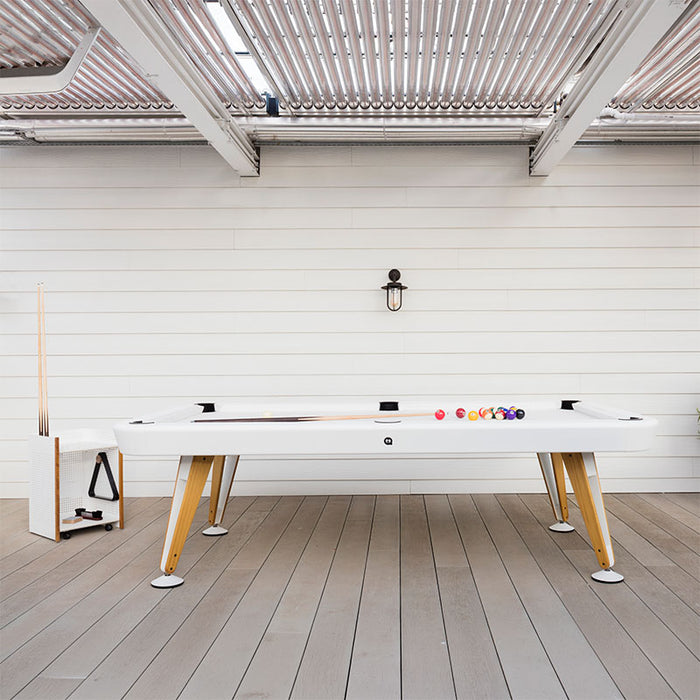 RS Barcelona Diagonal pool table on outdoor patio with billiard balls and cue stick ready for play.