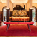 RS Barcelona Diagonal pool table in red finish positioned in a luxury bar interior with wooden columns and elegant lighting.