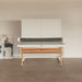 Front view of RS Barcelona folding ping pong table with minimalist white top, wooden legs and central net system in a modern indoor space.