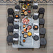 Overhead view of RS Barcelona RS Max dining football table fully set for dining with plates, food and stools, luxury glass dining table with integrated foosball game design