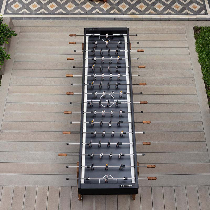 Top view of the RS Barcelona RS MAX football table with black frame and wooden handles, a large designer foosball table ideal for outdoor gardens and social spaces.
