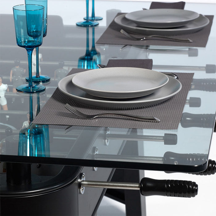 RS Barcelona RS2 Dining football table with glass top set for dining, modern foosball table with plates and blue glassware combining dining table and game table functionality.