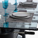RS Barcelona RS2 Dining football table with glass top set for dining, modern foosball table with plates and blue glassware combining dining table and game table functionality.