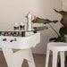 White RS Barcelona RS2 dining football table with glass top in modern interior, featuring foosball players beneath and coffee setup, multifunctional dining and game table design.