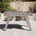 RS Barcelona RS2 football table in grey finish positioned on a modern outdoor terrace with plants and patio setting.