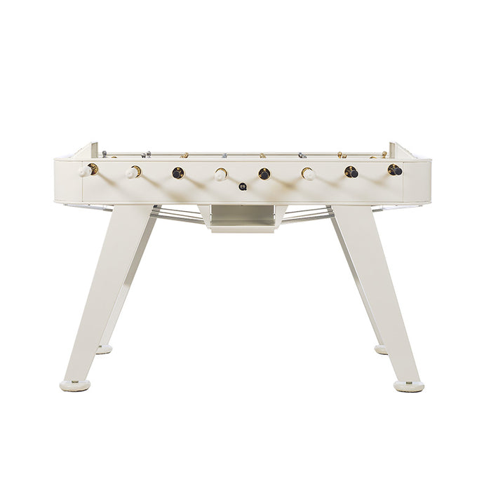 Front view of RS Barcelona RS2 Gold football table in white with gold hardware and sculptural legs, a modern luxury foosball table design.
