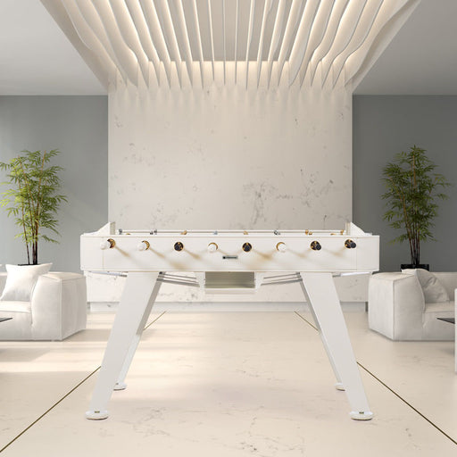 RS Barcelona RS2 Gold football table in white finish styled in a modern interior space, luxury designer foosball table for contemporary game rooms.