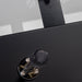 Detail of RS Barcelona RS3 dining football table glass tabletop mounting bracket and foosball handle on black metal frame.