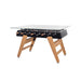 Front view of RS Barcelona RS3 dining football table featuring tempered glass tabletop, foosball handles and modern wooden leg frame.