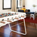 RS Barcelona RS3 football table in contemporary living room with white frame and wooden handles, stylish indoor foosball table with relaxed home setting and modern décor.