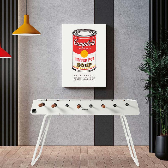 RS Barcelona RS3 football table in white with wooden handles, modern designer foosball table styled in a contemporary game room interior.