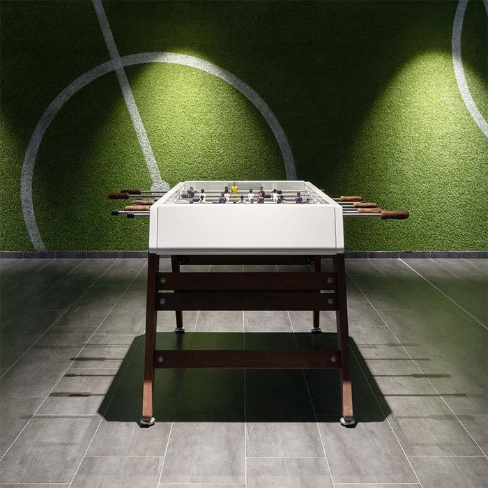 RS Barcelona RS3 Wood football table in modern indoor games room with green wall design, white frame and wooden legs, contemporary foosball table for stylish interiors.